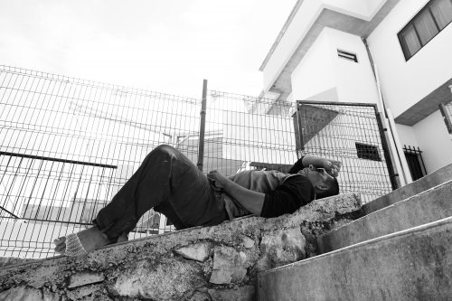A man rests inside the Casa del Caminante Jtatic Samuel Ruíz García migrant shelter in Pakal-Na after having his heavily blistered foot attended to. Recent changes to Mexican immigration enforcement along the southern border have made the process of migrating significantly more perilous for Central Americans headed to the United States. Whether caused by the dangers of riding the train or the physical toll of long treks through the dense jungles of southern Mexico, many of the migrants arrive at the shelter injured and in considerable pain.