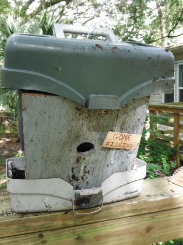 Some birdhouses mimic a defining object in a deceased person’s life. This birdhouse, made from a fishing tackle box, honors a person who loved to fish and be outdoors.