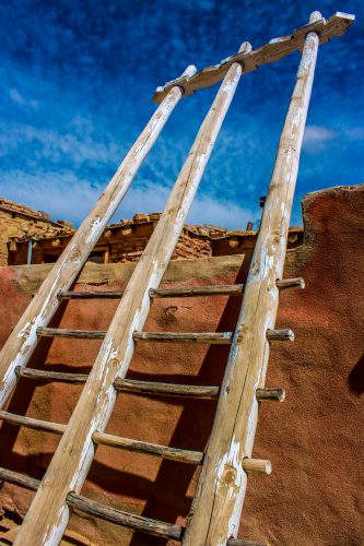At Acoma Pueblo, the kivas are built into the rows of homes rather than separated out such as at San Ildefonso Pueblo. A double ladder—perhaps one like this—can indicate a kiva. It can also signal the home of the religious leader of the pueblo.