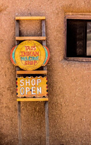 Along with Acoma and Hopi settlements, Taos Pueblo, a UNESCO World Heritage Site, is known to be one of the longest continuously inhabited villages in the United States. The pueblo was constructed on both banks of the Rio Pueblo de Taos between A.D. 1000 and 1450. The terraced-style architecture reached its most complex form at Taos. Though doors have been added to the ground level, outsiders are not allowed into the fragile upper levels of the pueblo, which are only accessible by ladder.