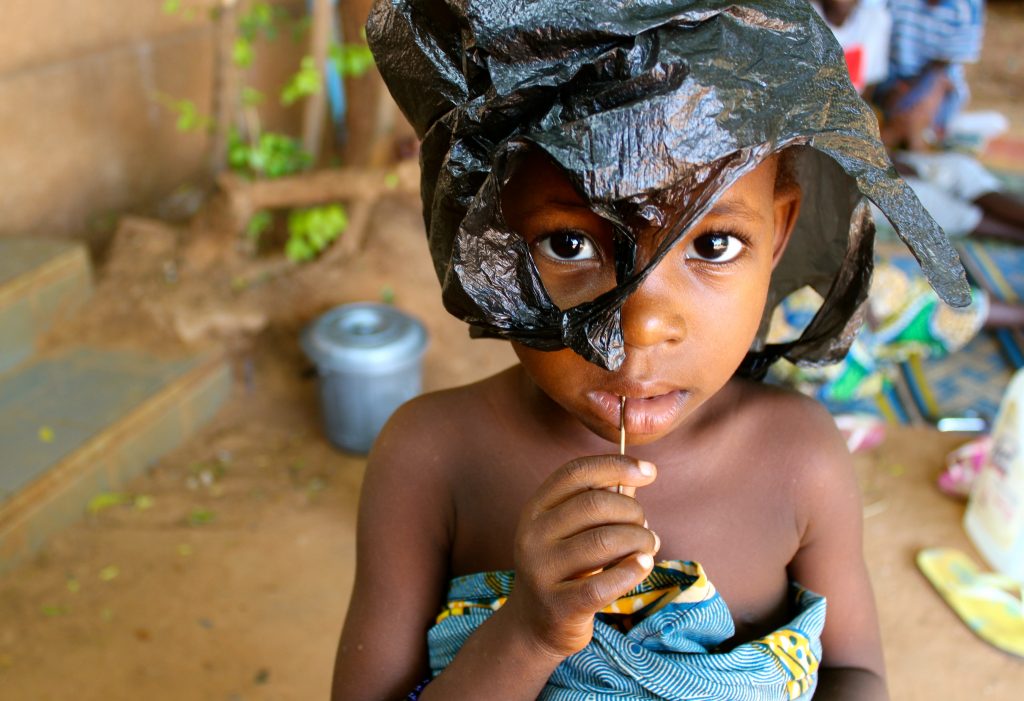 During the birth that causes fistula, 90 percent of babies die. Because women with fistula tend to have very poor access to maternal health care throughout their lives, when I counted stillbirths of all full-term pregnancies, the 100 women with fistula I came to know had a 76 percent child mortality rate. Beyond the doors of any fistula center, groups of children roam and play, but on the grounds of fistula hospitals, children are rare. Using discarded catheters and IV tubing as jump ropes and cardboard boxes as play cars, the handful of kids create a life of make believe in these confined, transitional spaces of waiting.