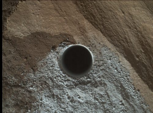 On April 24, 2016, NASA's rover Curiosity photographed a hole drilled into the surface of Mars to test the composition of Martian rocks.