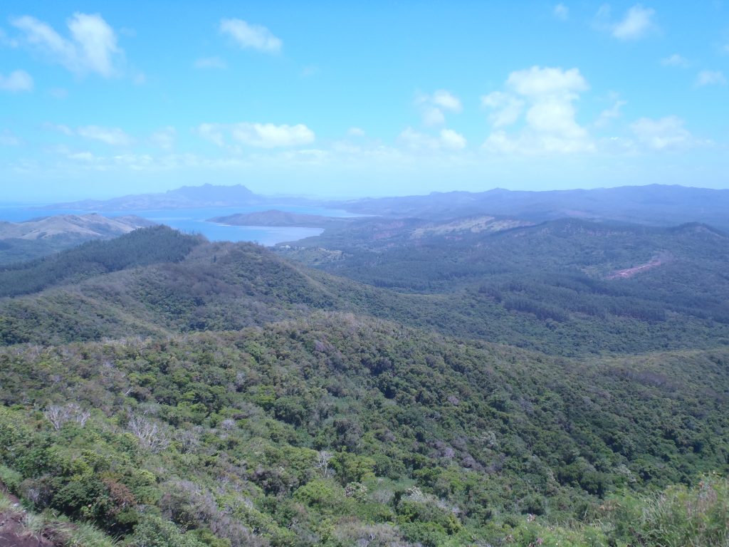 Looking northeast across the Seseleka Peninsula, beyond Rukuruku Bay, lies a summit once crowned with the war town of Naivaka.