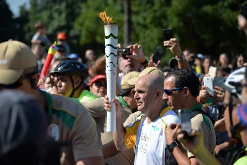 Olympic festival -- The torch relay is the most unscripted part of the Olympic program. Here, the torch travels through the Flamengo neighborhood on the day of the opening ceremony.