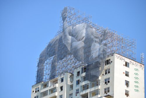 Olympic festival -- This public art installation, a 20-meter-high fabric artwork by French artist JR on top of the Hilton Santos building in Flamengo, depicts Sudanese high jumper Mohamed Younes Idris.