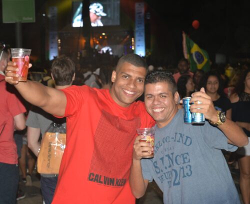 Olympic festival -- These spectators in Praça Mauá saw Niko with camera in hand, struck a party pose, and asked him to take their picture.
