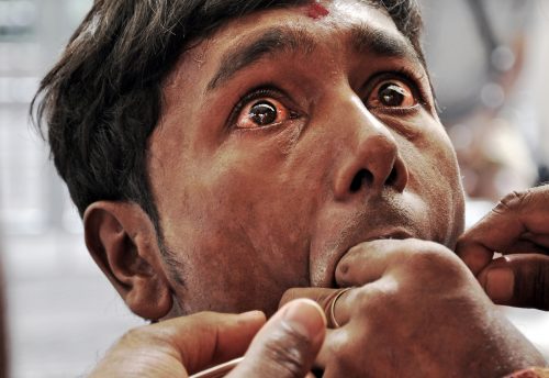 A man in Mauritius gets skewered through his cheeks during an ancient Hindu ceremony. The terror in his eyes will soon give way to more positive feelings. Painful rituals like piercing, flagellation, and fire-walking can release endorphins (natural opioids) in the brain and produce a state of euphoria. In a study of a ritual involving prolonged suffering, my colleagues and I showed that those who went through the most intense ordeals felt less tired and more euphoric after the event than onlookers who did not participate. These rituals can provide a sense of catharsis and redemption.