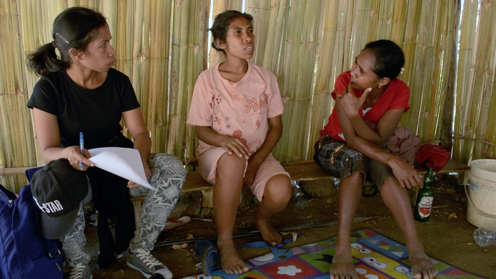 Infant mortality - Sidalia do Rego (left), of the Bairo Pite Clinic in Dili, and Mana Rosa (right), meet with Julieta Kebo (center) as part of their work to ensure that every pregnant woman in their community is cared for by a trained health care worker.