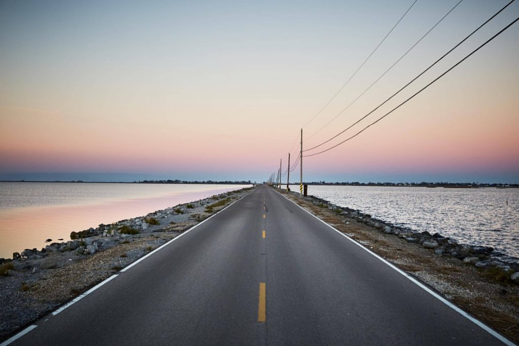 At high tide, school buses can’t drive down the submerged Island Road, connecting Pointe-au-Chien with Isle de Jean Charles.