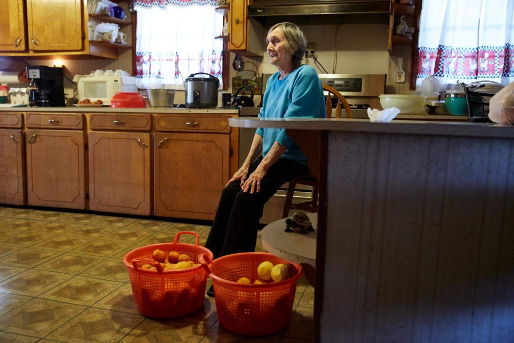Nazia Dardar, 83, in her kitchen with oranges from her daughter’s trees.