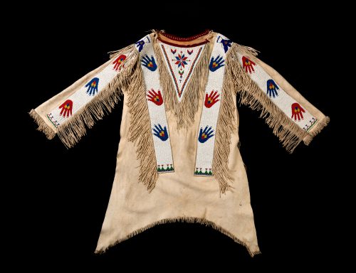 The Many Hands shirt was created around 1910 by Bessie Black Horn to commemorate the “multiple handshakes” that Chief Daniel Black Horn had with European dignitaries.