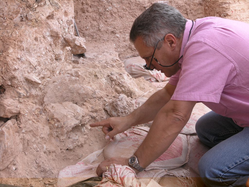 At the site of an old Moroccan mine, paleoanthropologist Jean-Jacques Hublin (pictured) points to one of the oldest Homo sapiens fossils yet found.