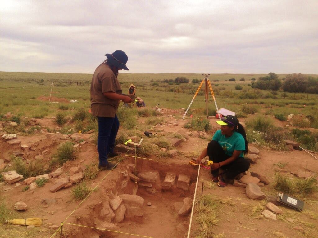 Two Native American archaeology students conduct research in Petrified Forest National Park in June 2015 as part of a field school project.