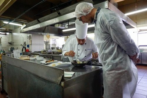 Co-author Adam Gamwell gets a cooking lesson from Chef Maguiña. This dish features baby alpaca meat and two types of quinoa.