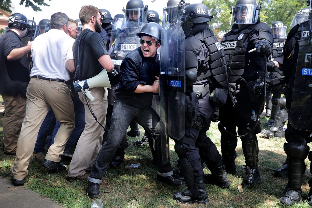 charlottesville violence - White supremacist ralliers faced unexpected resistance from police, who, instead of physically creating a barrier between them and the counterprotesters, forced them to leave Emancipation Park.
