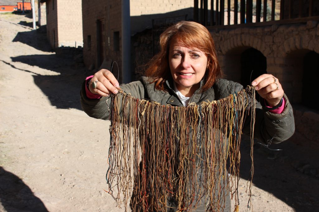 The author holds up a Collata khipu in July 2015.