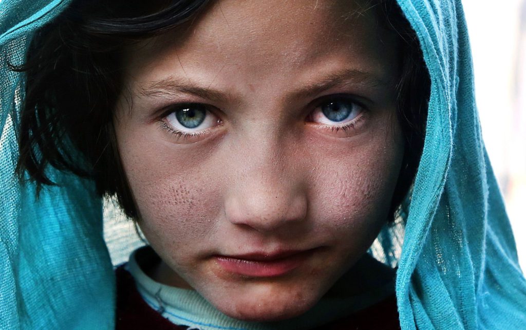 Human evolution social selection - This young Afghan refugee named Maimuna, photographed in Kabul in 2016, has features that are similar to ancient European hunter-gatherers.