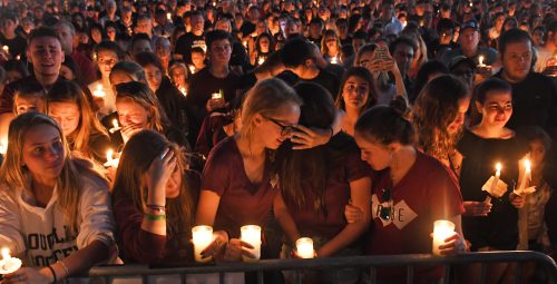 public grief - A candlelight vigil on February 15 honored the victims of the recent mass shooting at a high school in Parkland, Florida.