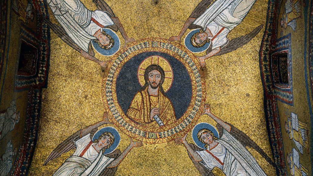 A mosaic features four angels in white with wings surrounding a man in a central circle - all against a yellow background.