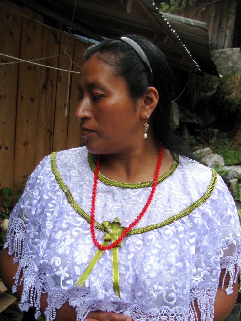 Eugenia poses for a portrait in her traditional Nahua garments.