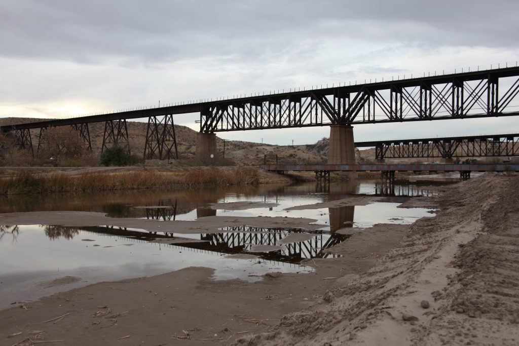 A section of the river-border between El Paso and Ciudad Juárez lies quiet, bereft of life.
