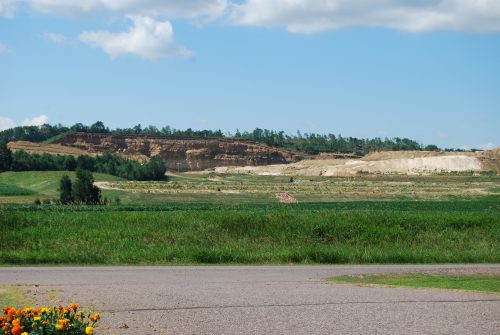 This frac sand mine operated by Superior Silica Sands, which is part of Emerge Energy Services out of Fort Worth, Texas, cuts into a hillside in July 2013 across from the Auburn town hall in Chippewa County, Wisconsin. From 2009 to August of 2016, Chippewa County has permitted 13 frac sand mining operations, amounting to 3,706 acres of land. The mines are clustered in three adjacent townships located just south of Dovre.