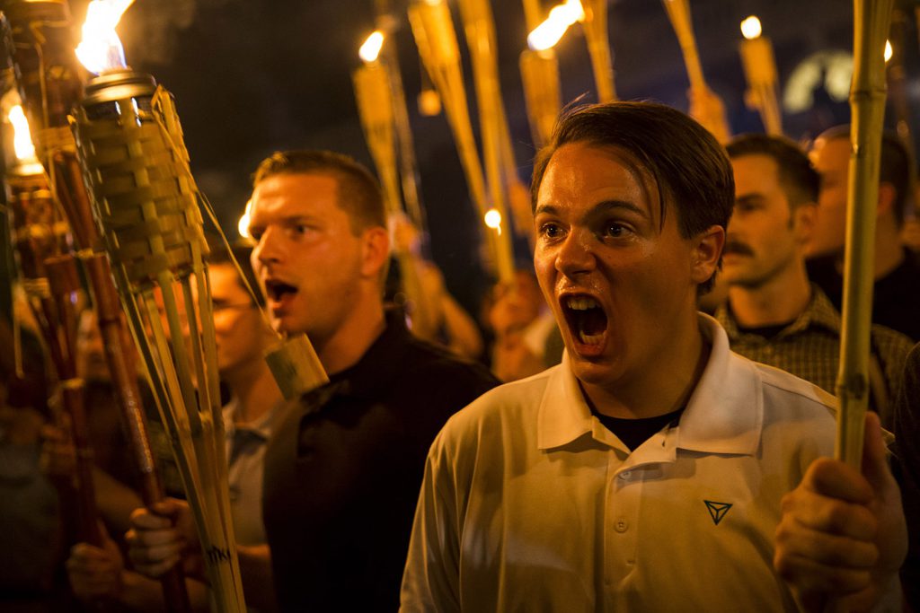Consumer DNA tests have been used by some white supremacists to fuel their perceptions of their own “racial purity.” In this photo, protestors rally to defend white supremacy on the grounds of the University of Virginia campus in August of 2017.