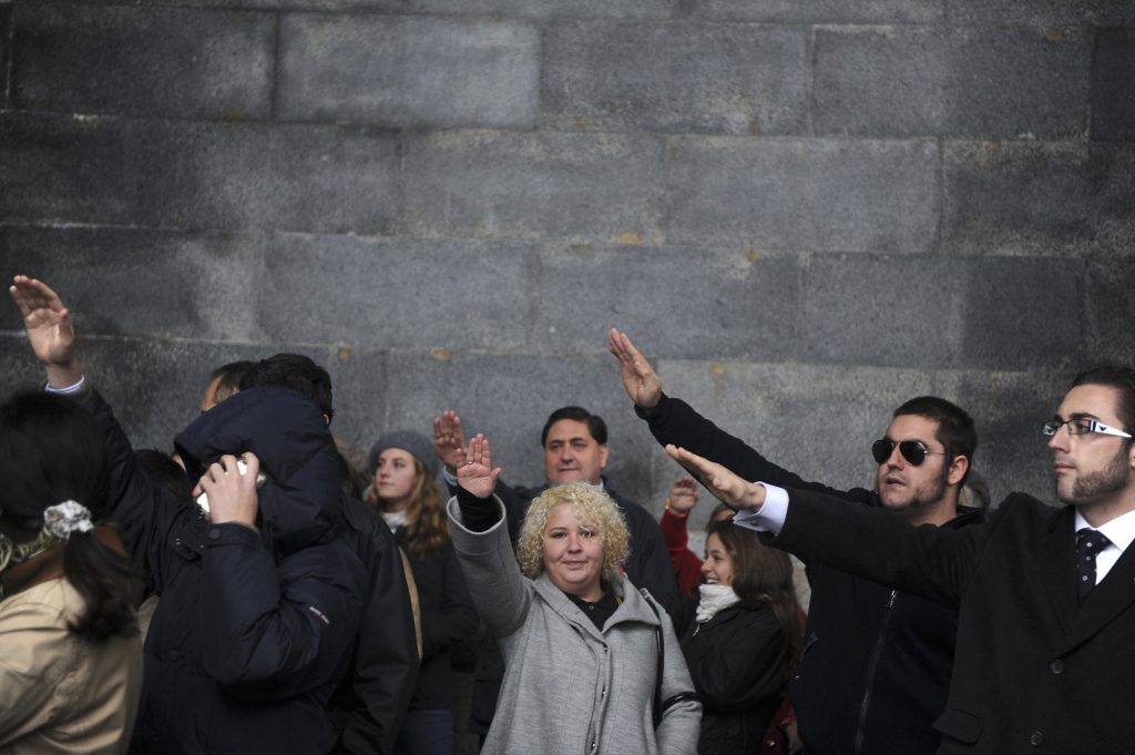 People make the fascist salute on November 20, 2011, at the Valley of the Fallen—the basilica near Madrid, Spain, where the country’s former dictator Gen. Francisco Franco is entombed—after a mass commemorating the 36th anniversary of Franco's death.
