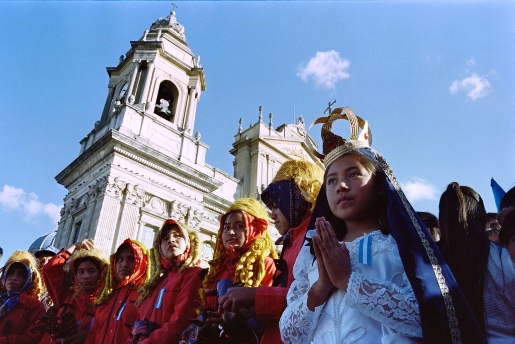Maya children participated in a procession in front of the cathedral of Guatemala City on December 29, 1996, to celebrate the signing of a peace agreement that many hoped would end 36 years of violence and genocide in the country.