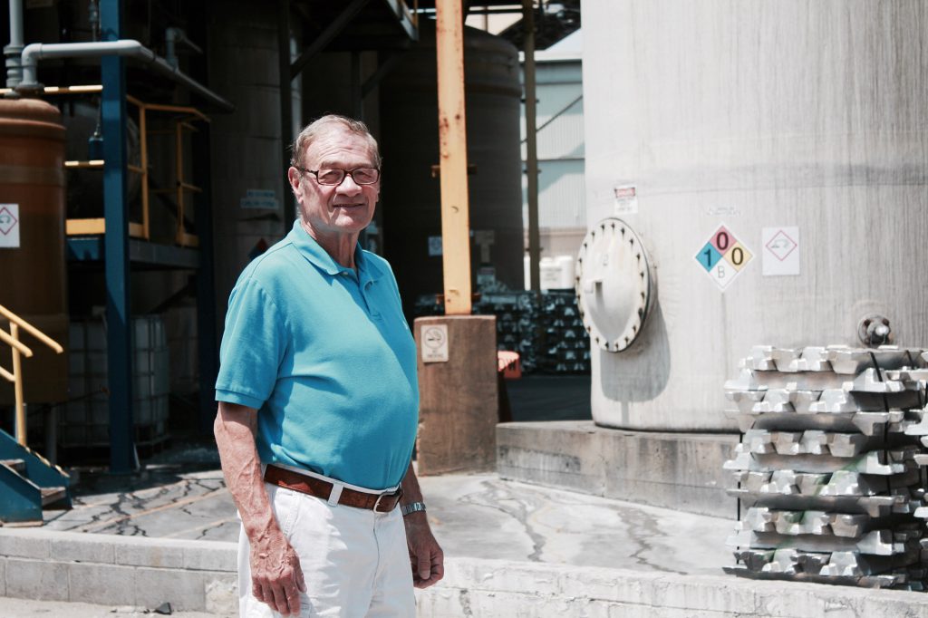 Frank stands at the site of his last job, which was at a chemical company.