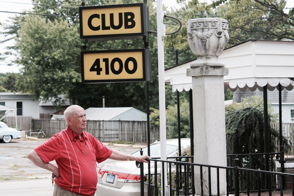 Arthur (pictured here) and his wife first met at Club 4100 when it served as a popular watering hole for locals. Some time ago, it closed down—but someone still cleans the sign.