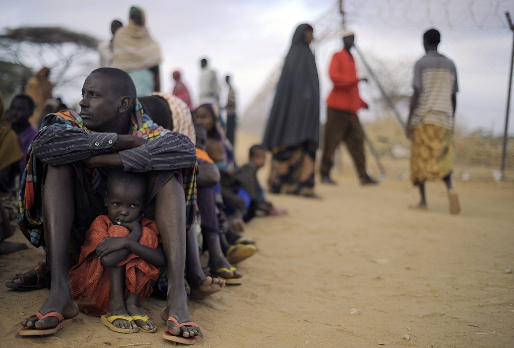 A Somali father and his daughter waited to register at the Dagahaley refugee camp in Kenya in 2011, when drought and discord forced some 130,000 people to flee neighboring Somalia.