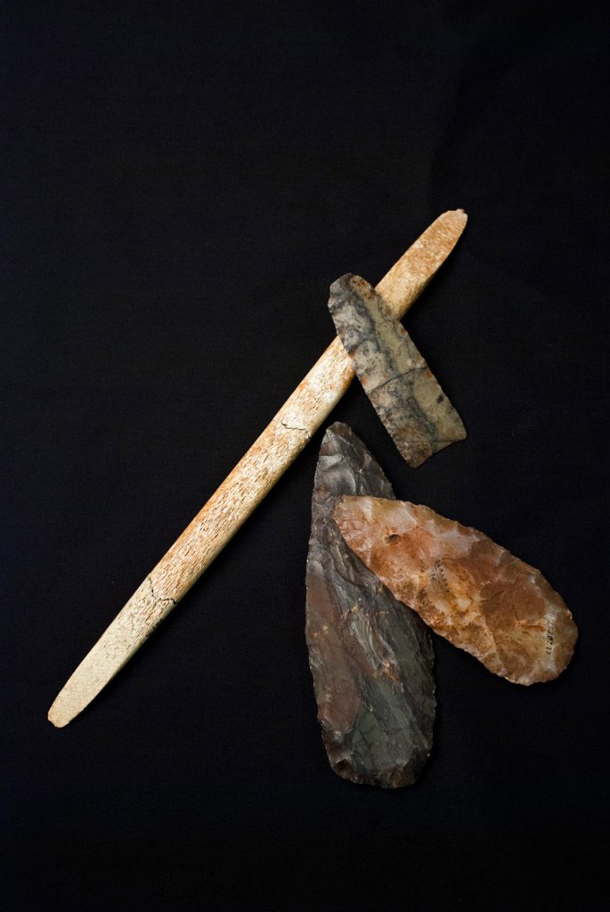 New dating shows that an ancient boy interred with these artifacts in present-day Montana is indeed 13,000 years old.