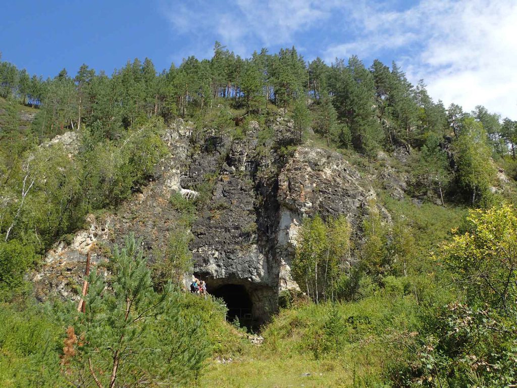 Lush vegetation now covers the hillside where the entrance to Denisova Cave lies.