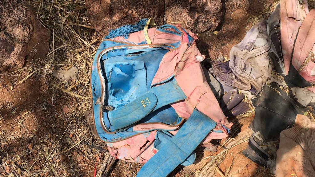 mexico border - A child’s backpack abandoned on a migrant trail in the Tumacácori Mountains suffers the decay of time.