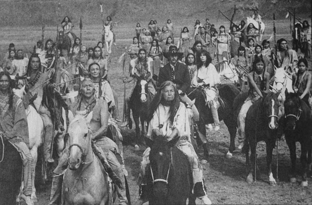 A group of Lakota Sioux ride with Lt. John Dunbar, played by Kevin Costner, in a scene from the movie Dances With Wolves.