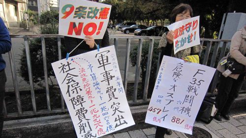 japan military - Protestors in Tokyo voice their concerns about Prime Minister Abe's militarization drive in 2017.