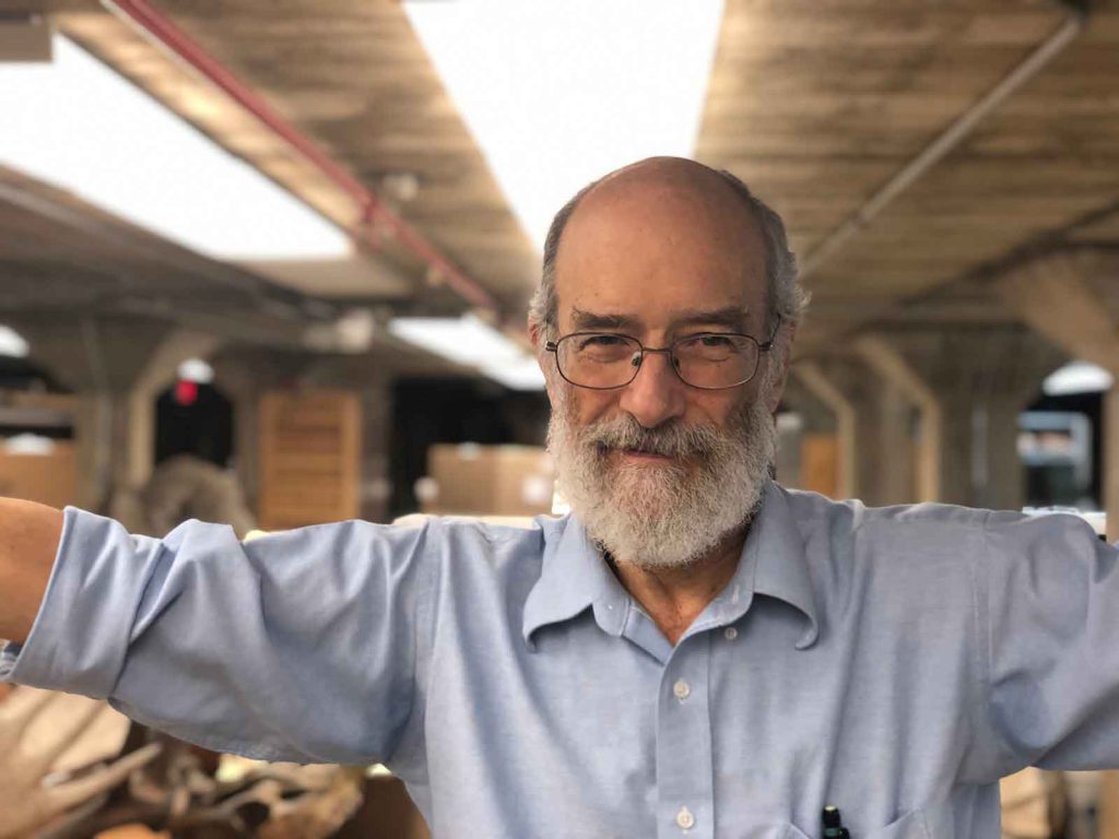 Paleontologist Dan Fisher stands amid part of his collection at the University of Michigan.