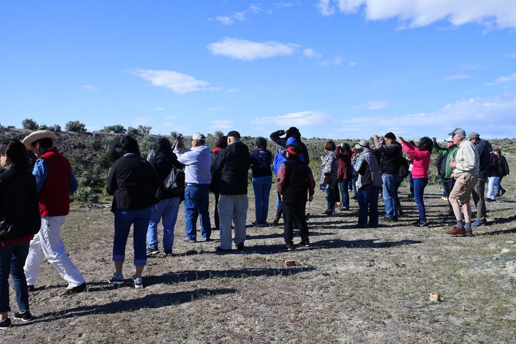 Members of the Chinese Railroad Workers Descendants Association take photos at the first stop on the transcontinental railroad grade tour in May 2019.
