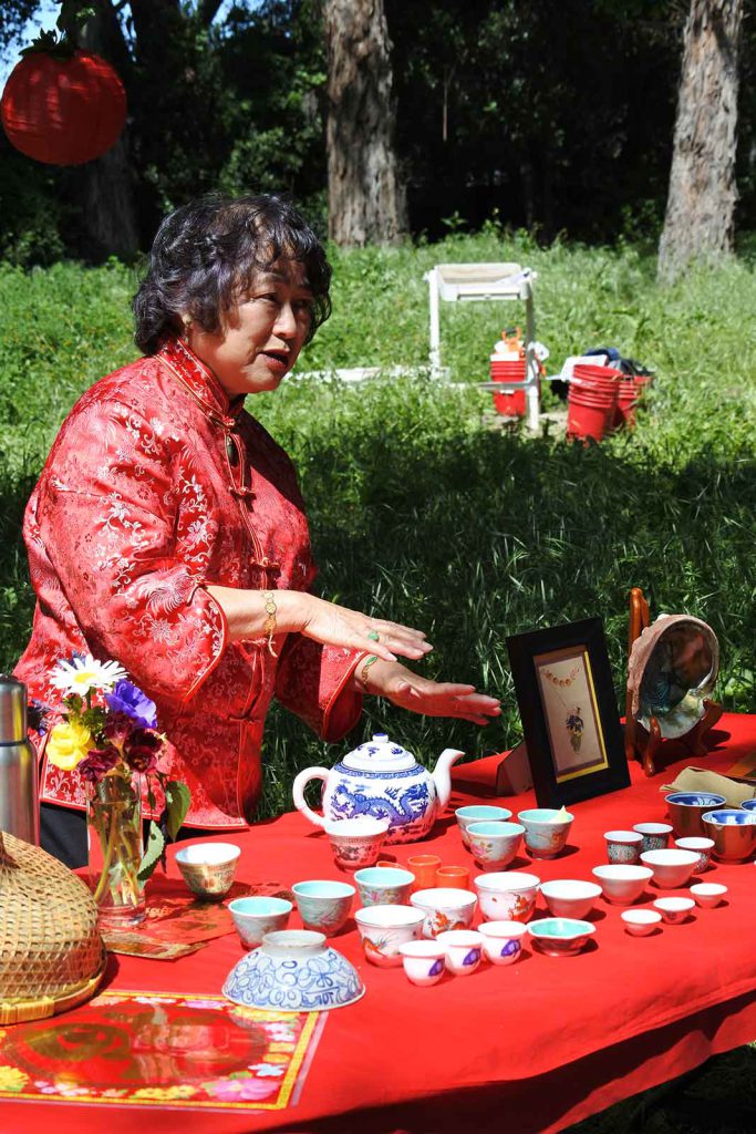 Gerry Low Sabado has led tea ceremonies in a variety of venues to honor Chinese ancestors. In this photo, she initiates the start of an archaeological project at the Stanford Arboretum excavating Chinese workers' residences.
