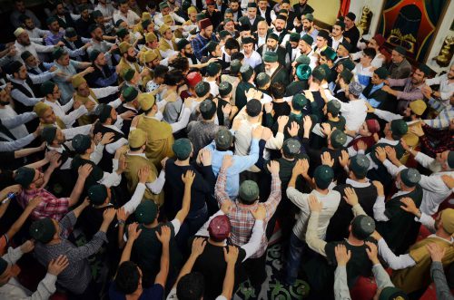 At the end of the ritual, dervishes form an unbroken line of physical contact directly to the shaykh while reciting an especially long chant. When the leader starts to leave, the dervishes scramble to occupy space along the shaykh’s return path to his quarters, hoping to kiss his robe or graze his outstretched fingers. Such closeness to the shaykh is believed to impart desirable spiritual rewards. The ensuing melee is disorganized and intense, but bruised egos (and bodies) are usually forgiven among these de facto brothers.