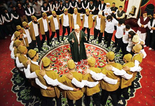 Advanced dervishes form a ring around the shaykh for some portions of the dhikr. As the congregation chants and sings, the vibrations collectively resonate, making it hard to determine whose voice is producing which sound. This has a powerful ego-deconstructing effect. While conducting participant observation, Manoharan on some occasions believed that he had deepened his vocal range through constant dhikr practice, only to realize later that he was mistaking a nearby dervish’s voice for his own.