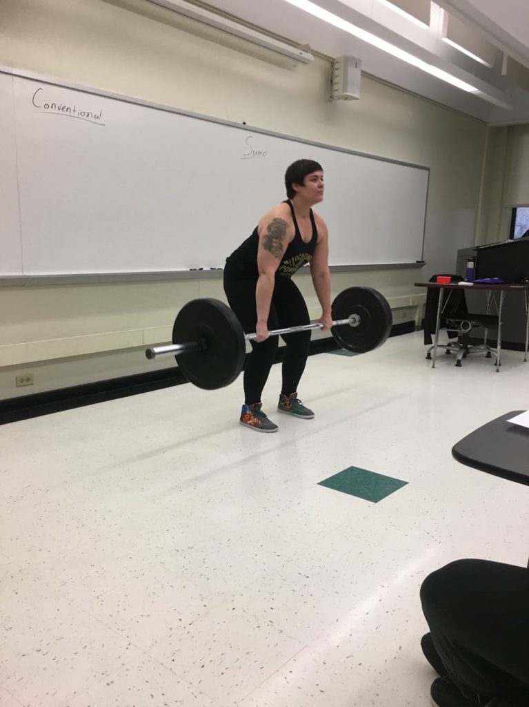 Cara Ocobock takes powerlifting out of the gym and into the classroom to demonstrate the biomechanical differences between conventional and sumo deadlifts.