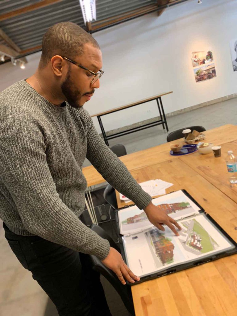 Mixed-Income Housing - Former curator Robert Smith III discusses an exhibit at the National Public Housing Museum’s temporary gallery on Kingsbury Street.