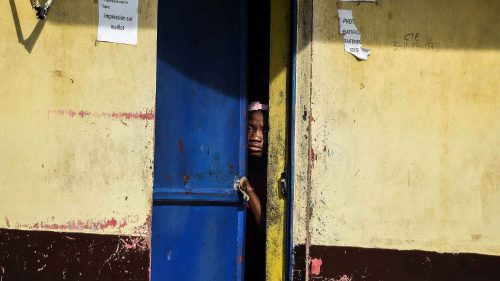 Haiti blackouts - On September 25, a girl in Port-au-Prince, Haiti, watches as protesters denounce fuel shortages and demand the resignation of President Jovenel Moïse.