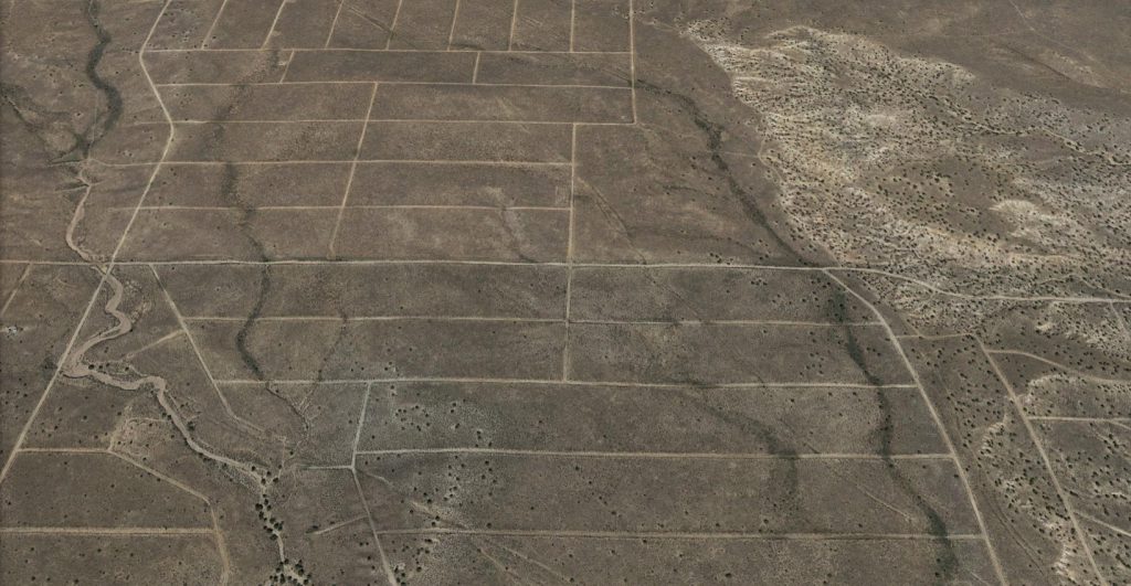 In this undeveloped section of Rio Rancho Estates, New Mexico, roads have been cut, but virtually no homes have been constructed for decades.