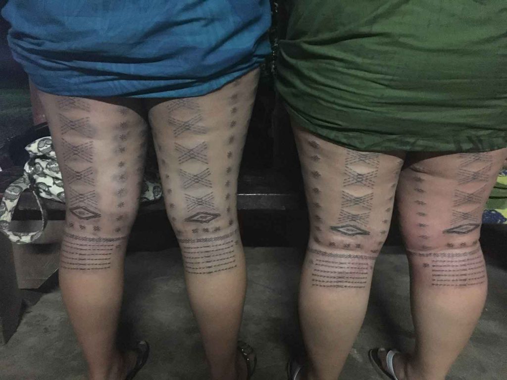 Two sisters display their malu, the traditional tattoo some Samoan women receive, which was inked by Sulu'ape Tatau.