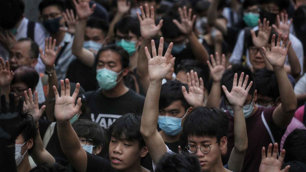 Harmony - Pro-democracy protesters in Hong Kong hold up their hands to represent their five demands for the city’s government.