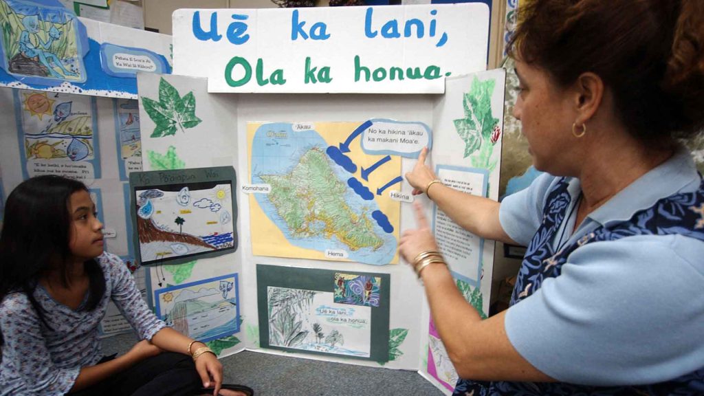 Hawaiian language teacher Nako’olani Warrington instructs 9-year-old Maleka Benjamin at an immersion school in Honolulu.