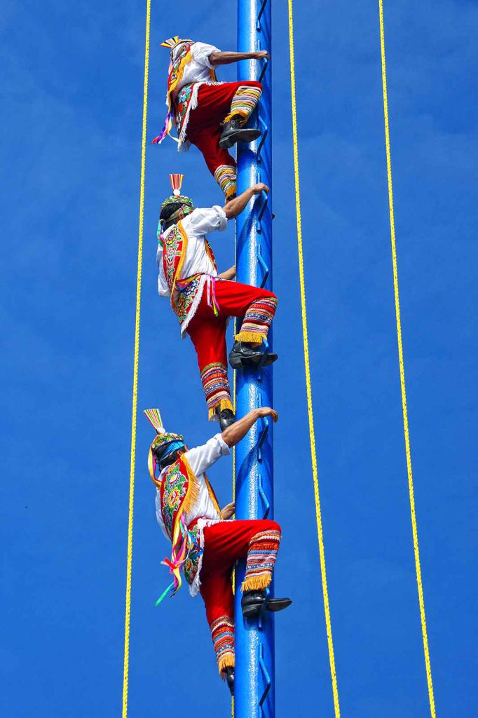 Participants prepare to leap from a 30-meter pole as part of a palo volador ceremony in Veracruz, Mexico.